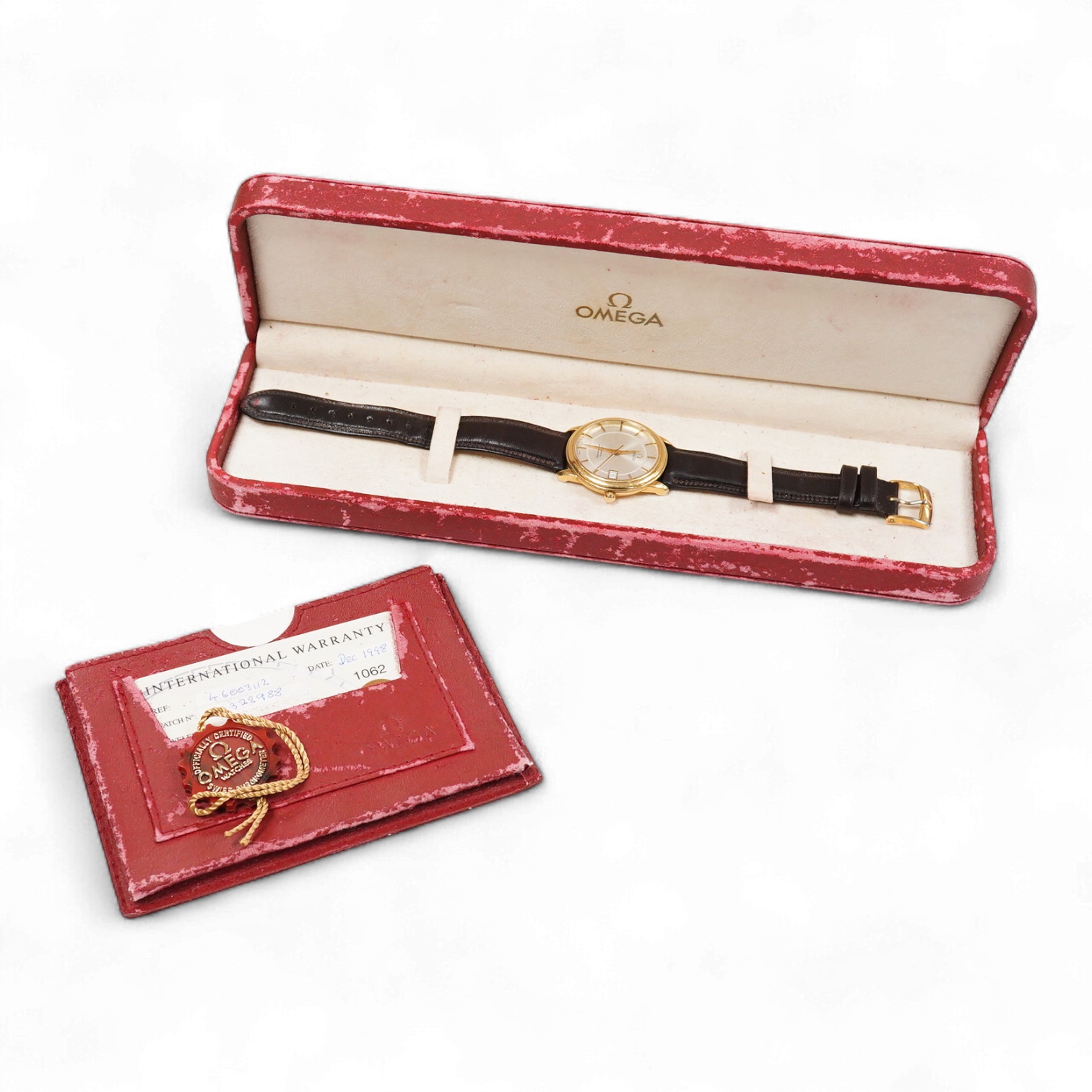 A gentleman's late 1990's 18ct gold Omega Automatic Chronometer wrist watch, with baton numerals and date aperture, case diameter 35mm, on an associated leather stray with plated buckle with Omega insignia, with box and